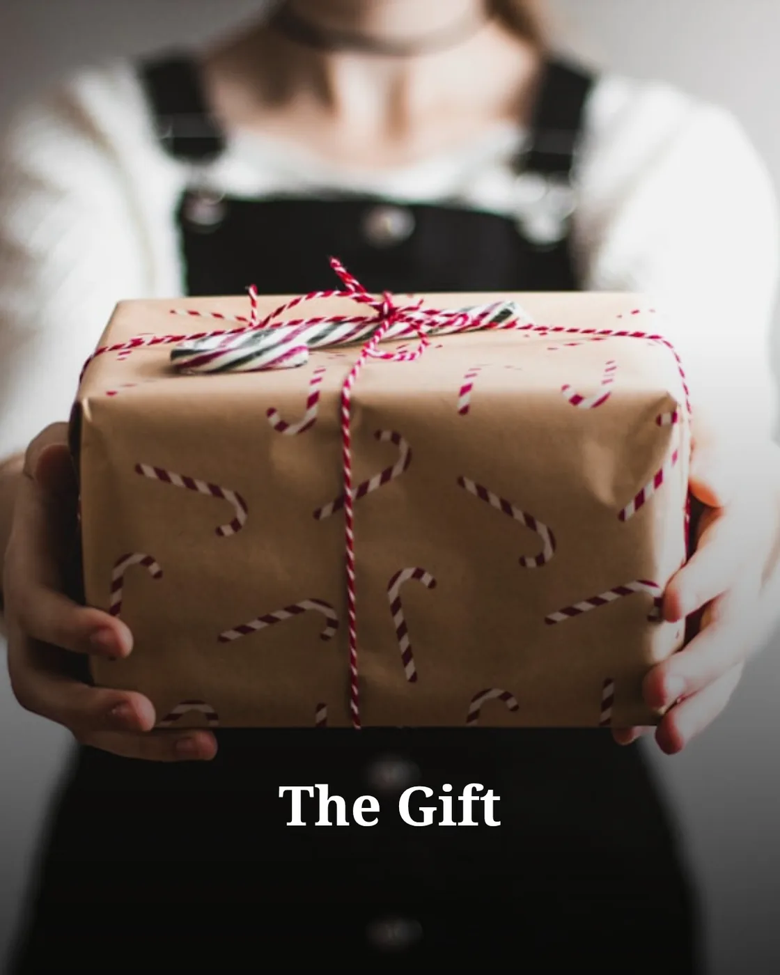 person showing brown gift box