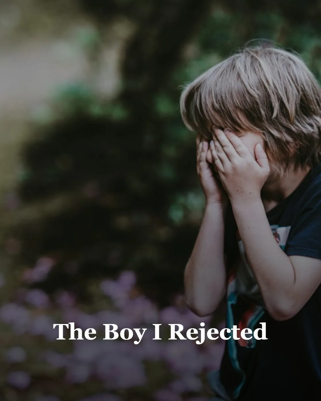 boy covering his face while standing