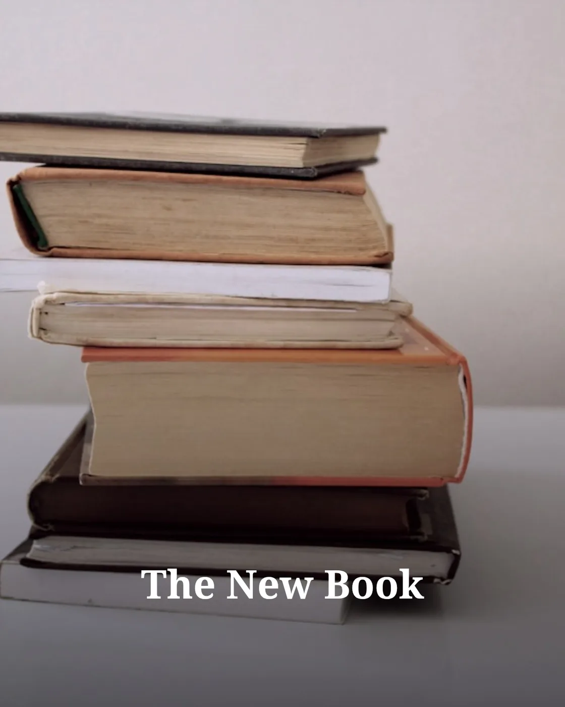 brown hardbound books on black book